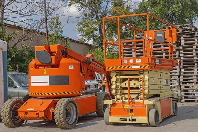 warehouse worker operating forklift to stack inventory in Northbrook